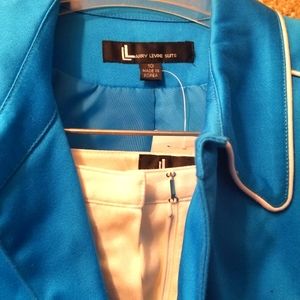 Beautiful blue 2 piece suit. Aqua blue knee length jacket and boot cut slacks